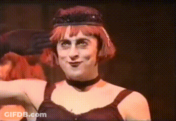 Red-Haired Woman With Black Hat And Choker GIF