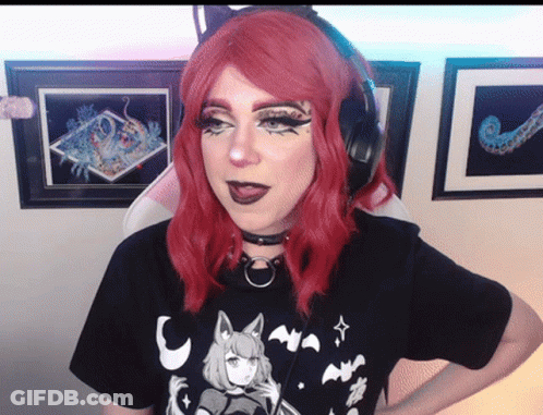 Red-Haired Woman With Headphones And Black T-Shirt GIF