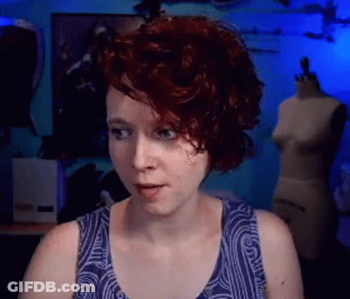 Red-Haired Woman With Wrestling Belt And Gloves Funny Face GIF