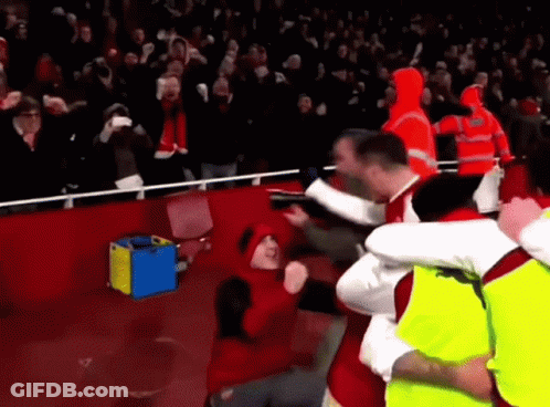 Red Hat Man Held By Yellow Vest Soccer GIF