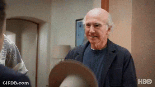 Red Hat Man Talking In Grocery Store GIF
