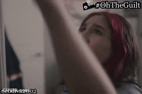 Red-Headed Woman Looking Up Oh The Guilt GIF