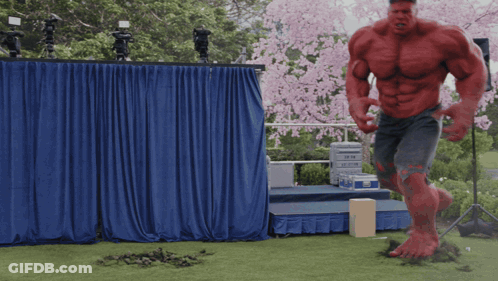 Red Hulk Standing In Front Of Stage GIF