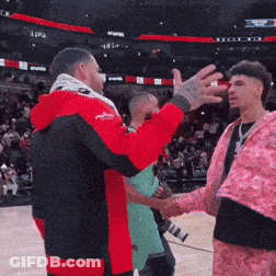 Red Jacket Man Shaking Hands With Pink Jacket Man GIF