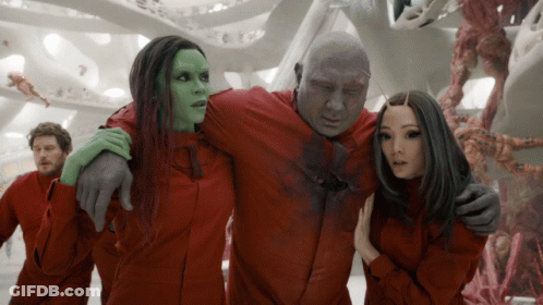 Red Jumpsuit People Standing GIF