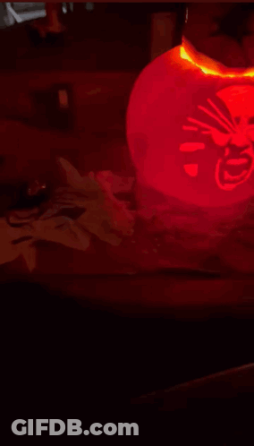 Red Lantern With Chinese Writing Lit Up In Dark GIF
