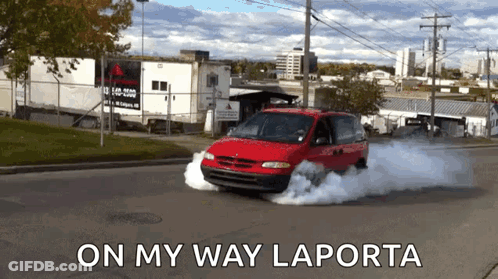 Red Minivan Driving With Smoke Saying On My Way Laporta GIF