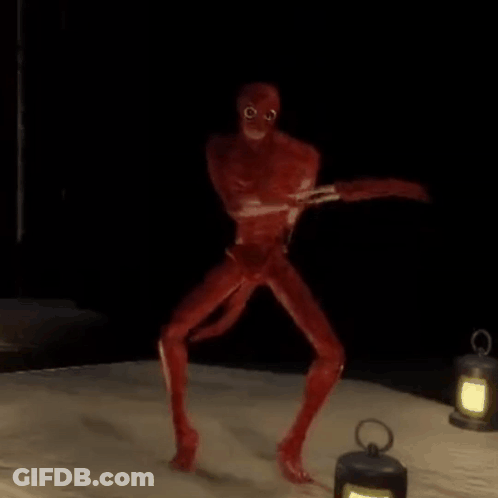 Red Monster Standing On Bed Next To Lantern GIF