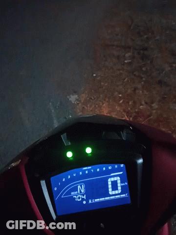 Red Motorcycle Digital Display Showing 1:25 GIF