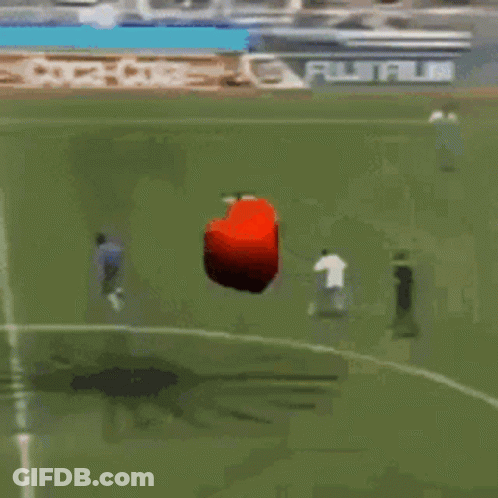 Red Object Flying Over Coca-Cola Soccer Field GIF