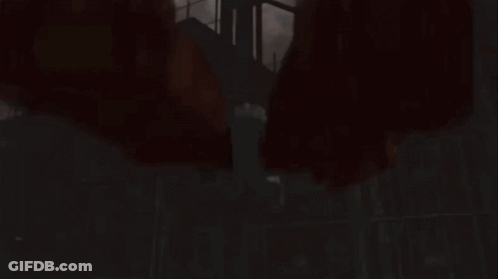 Red Object On A Pole In Front Of Cloudy Sky GIF