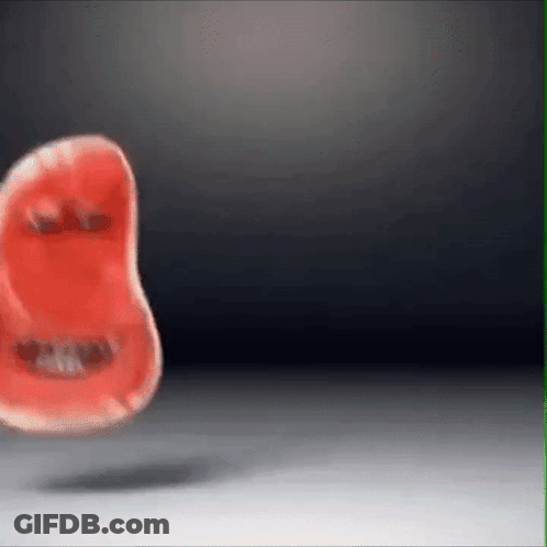 Red Object With Face Floating On White Surface GIF