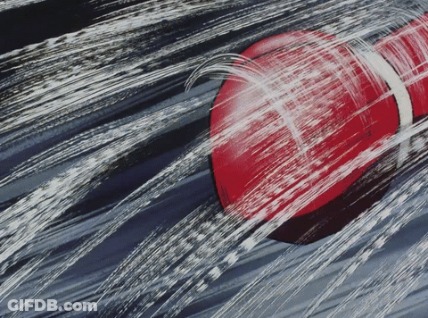Red Object With White Stripe Sprayed With Water GIF