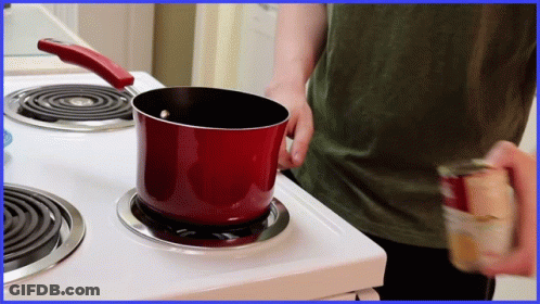 Red Pot On Stove Next To Soup Can GIF