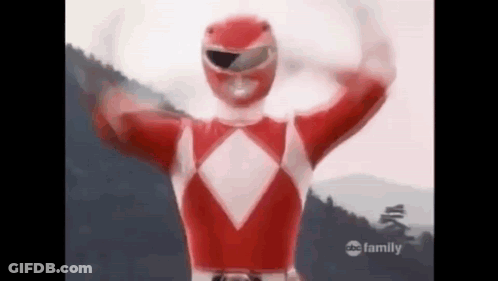 Red Power Ranger Arms Outstretched In Front Of Mountain GIF