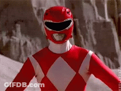 Red Power Ranger Smiling In Front Of Rock Wall GIF