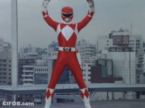 Red Power Ranger Standing In City GIF