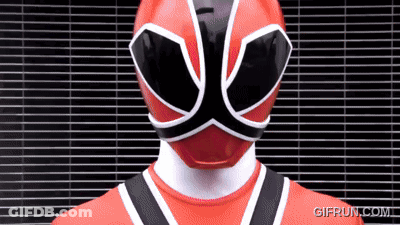 Red Power Ranger Standing In Front Of Brick Wall GIF