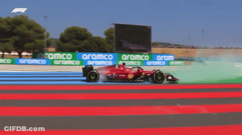 Red Race Car On Track With Aramco Banners GIF