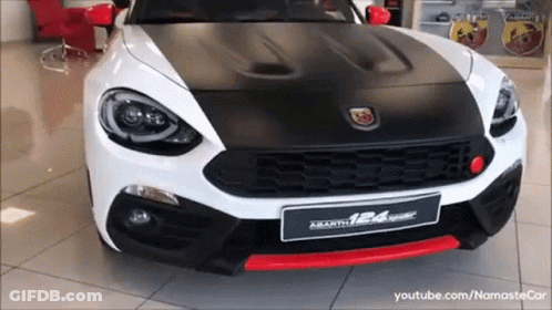 Red Renault Car Parked In Showroom GIF