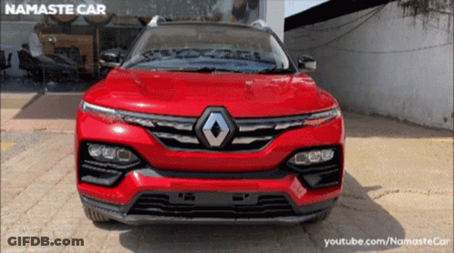 Red Renault Parked In Front Of Namaste Car Store GIF