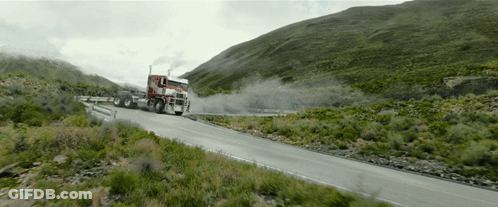 Red Semi Truck Driving On Mountain Road GIF