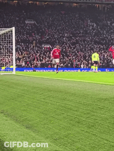Red Shirt Man At Podium With In Jamad Sign GIF