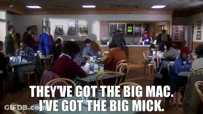 Red Shirt Man Next To Black Shirt Man GIF