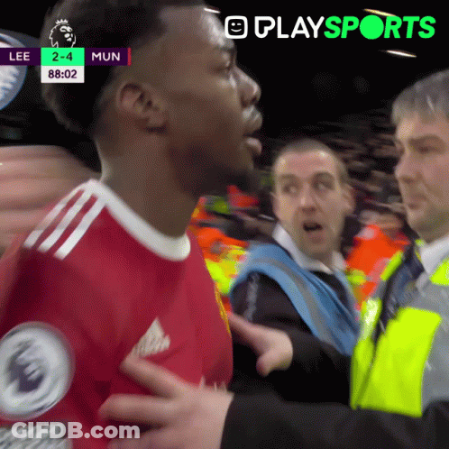 Red Shirt Man Talking Yellow Vest Man Soccer GIF