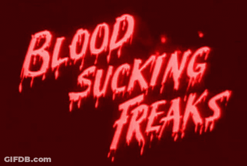 Red Sign Saying Blood Sucking Freaks GIF
