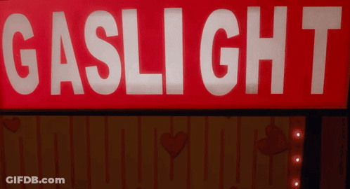 Red Sign Saying Gaslight 7 Lit Up GIF