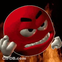 Red Smiley Making Funny Face In Front Of Fire GIF