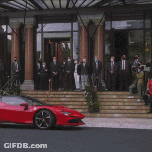 Red Sports Car And Group Of People GIF