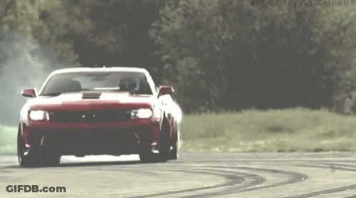Red Sports Car Drifting On Track With Trees GIF