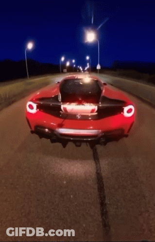 Red Sports Car Driving At Night GIF