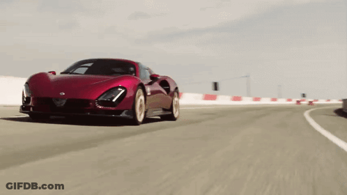 Red Sports Car Driving Down Road GIF