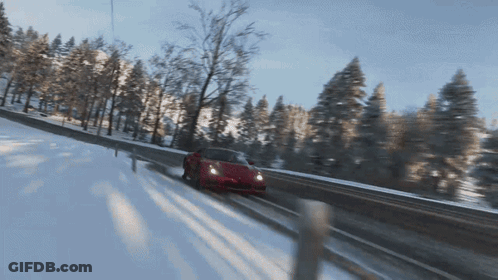 Red Sports Car Driving On Snowy Road GIF