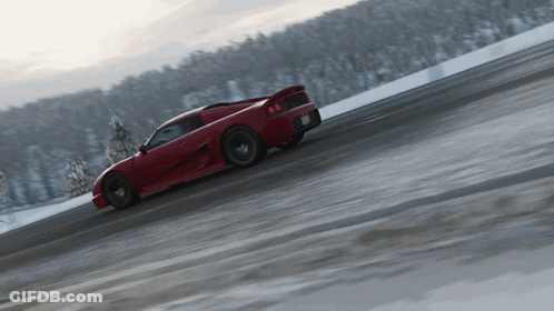 Red Sports Car Driving On Snowy Road GIF