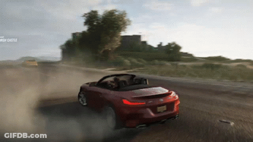 Red Sports Car On Dirt Road With Church Castle GIF