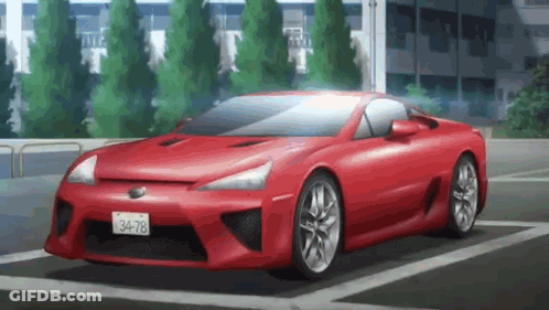 Red Sports Car Parked In Lot With Building GIF