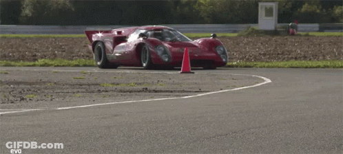 Red Sports Car With Pia On Windshield GIF