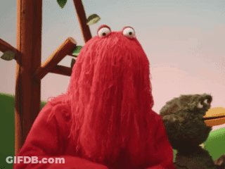 Red Stuffed Animal With Frog Behind GIF