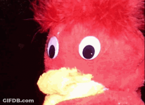 Red Stuffed Animal With Yellow Beak And Big Eyes GIF
