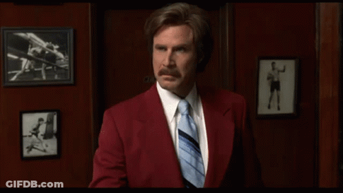 Red Suit Man Holding Paper With Blue Tie GIF