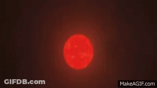 Red Sun Shining In Dark Sky GIF
