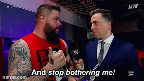 Red Tank Top Man Tells Suited Man Stop Bothering Me GIF