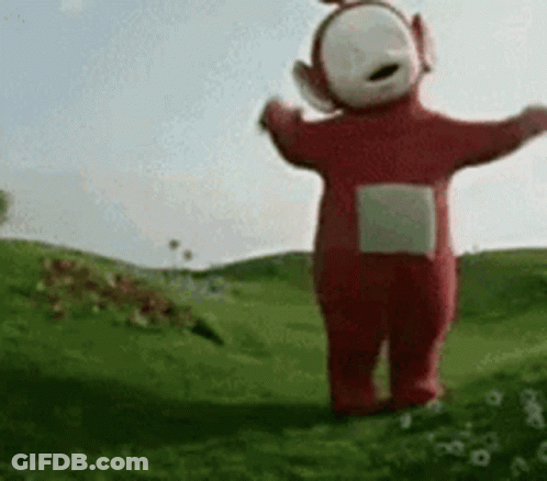 Red Teletubbies Standing In Grass GIF