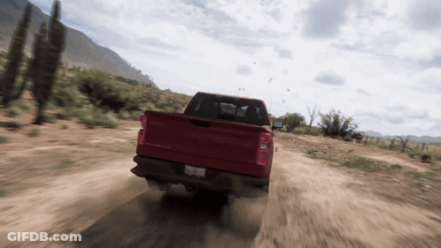 Red Truck Driving On Dirt Road GIF