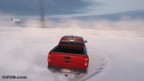 Red Truck With New York License Plate Driving Through Snow GIF