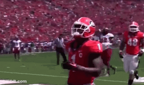 Red Uniform Football Player Running With Ball GIF